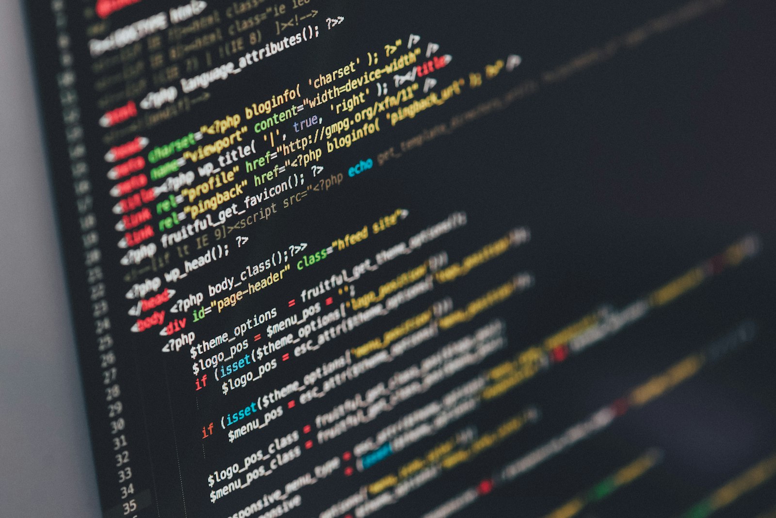 Website source code displayed on a monitor